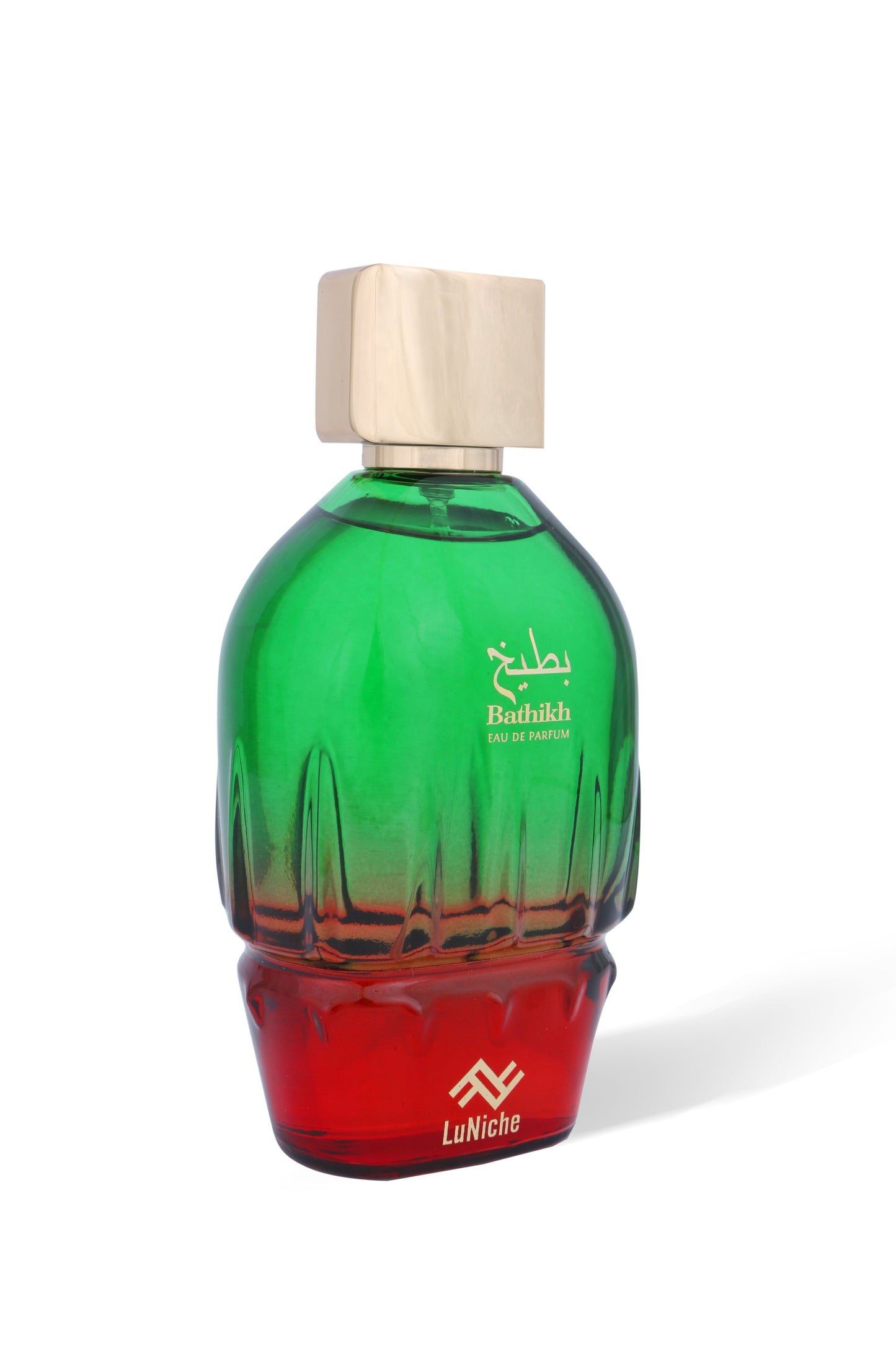 Green and red perfume bottle with wooden cap on a white background